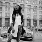 A black and white of a woman traveling