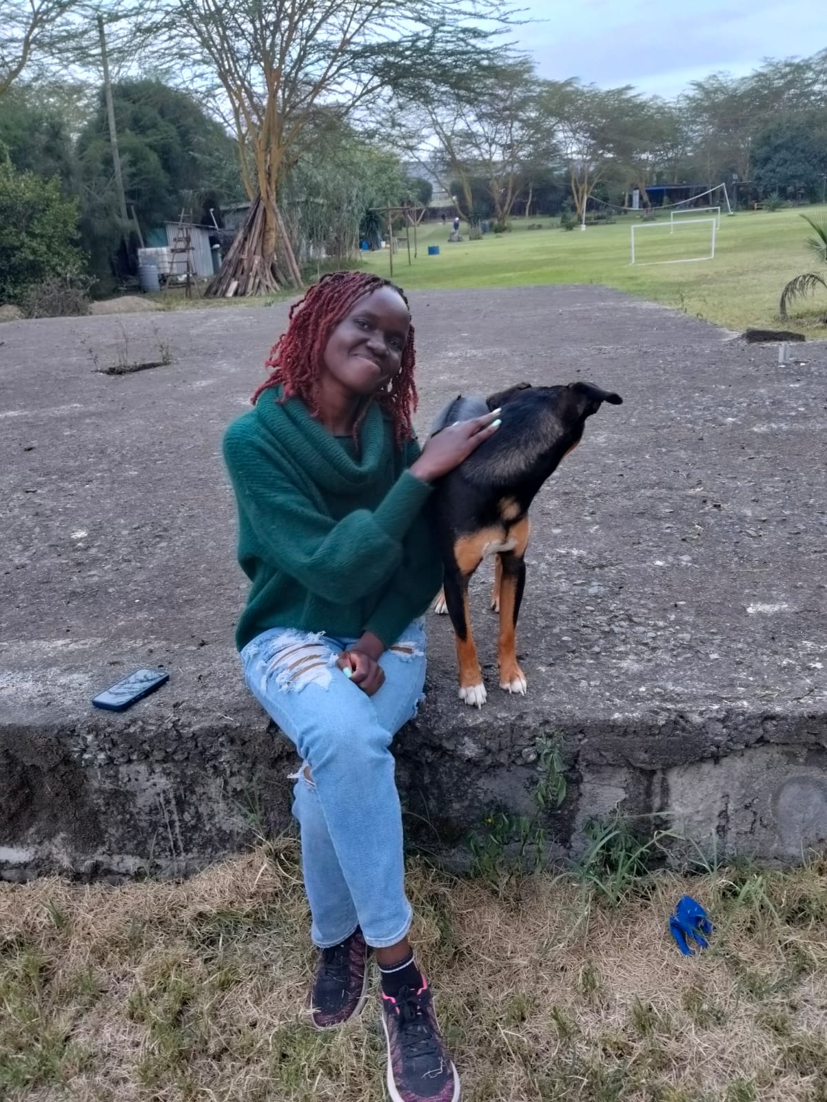 A woman petting a dog