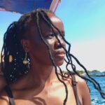 A woman in a boat in the ocean