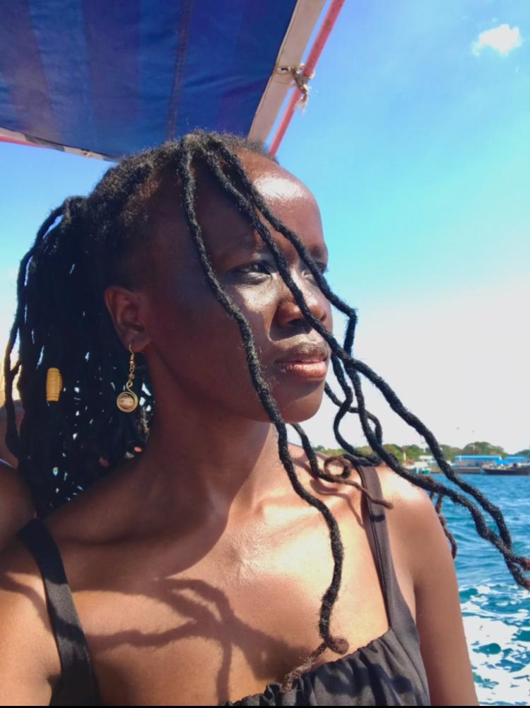 A woman in a boat in the ocean